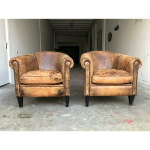 Set zeer doorleefde schapenleren clubfauteuils vintage