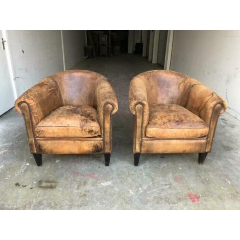 Set zeer doorleefde schapenleren clubfauteuils vintage