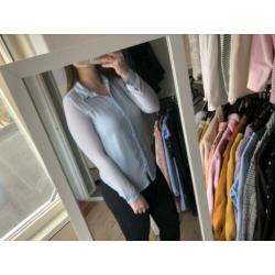Doorzichtige lichtblauwe blouse maat s