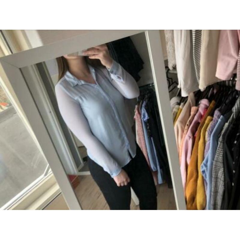 Doorzichtige lichtblauwe blouse maat s