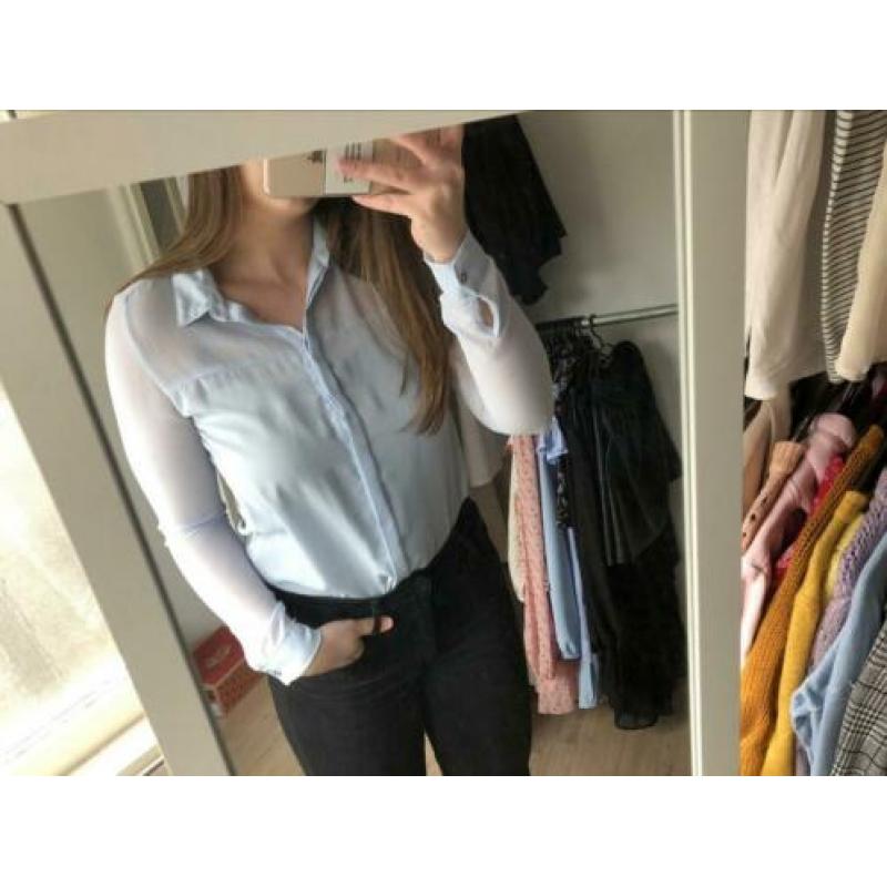 Doorzichtige lichtblauwe blouse maat s