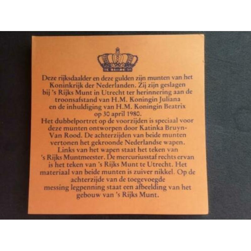 Rijksdaalder en gulden in cassette