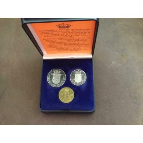 Rijksdaalder en gulden in cassette