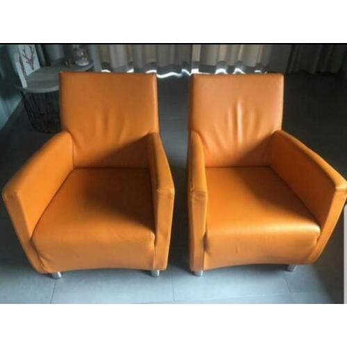 Oranje lederen stoelen. Goed onderhouden!